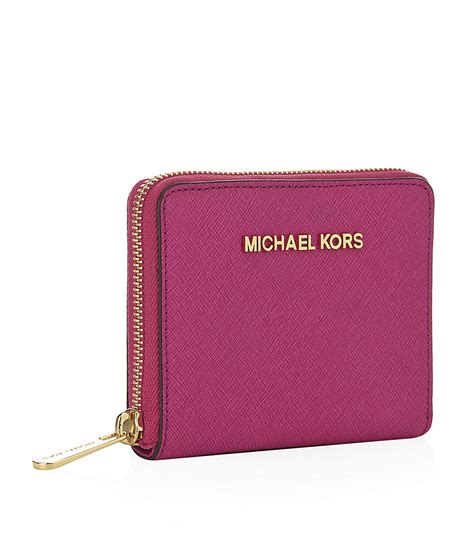 michael kors small pink wallet.